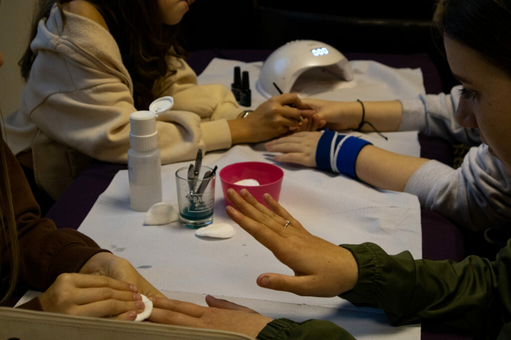 Hair and beauty course - young people doing each other nails