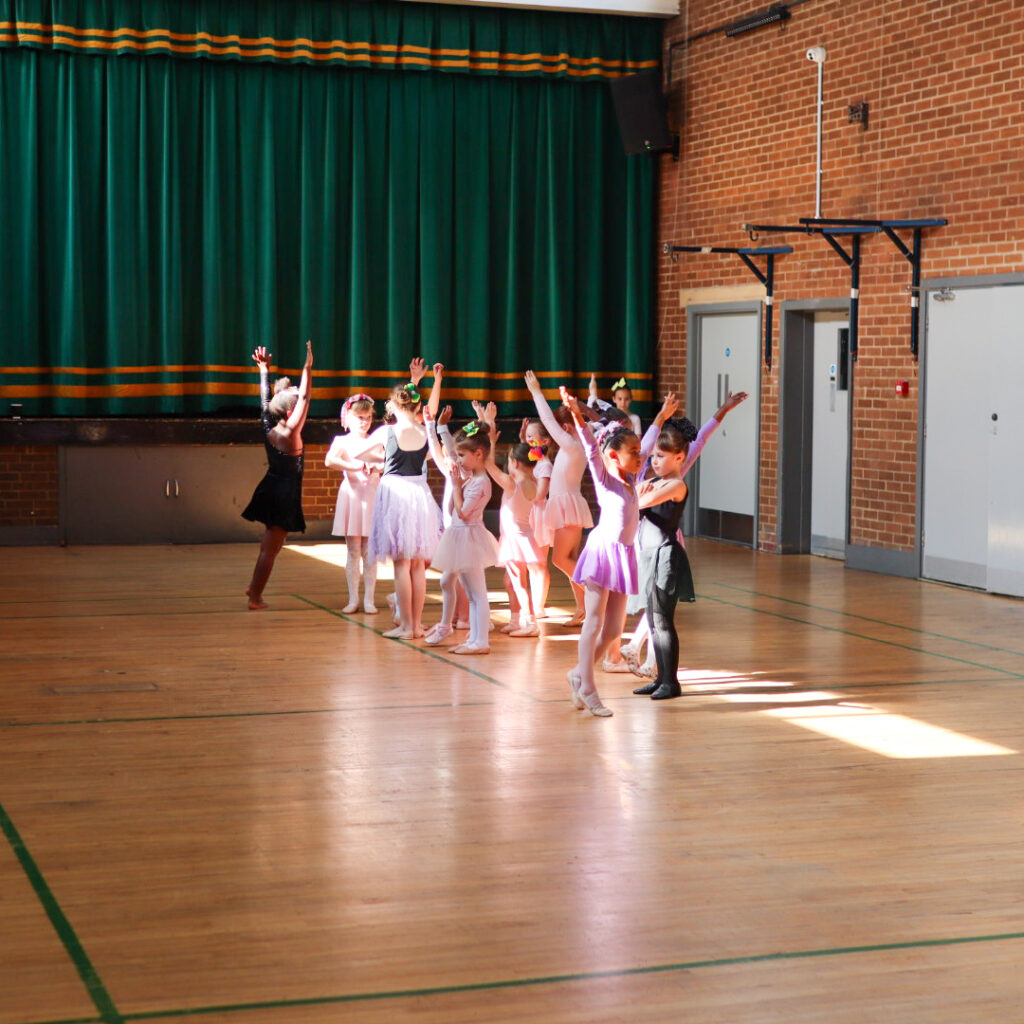 A collection of young people doing ballet