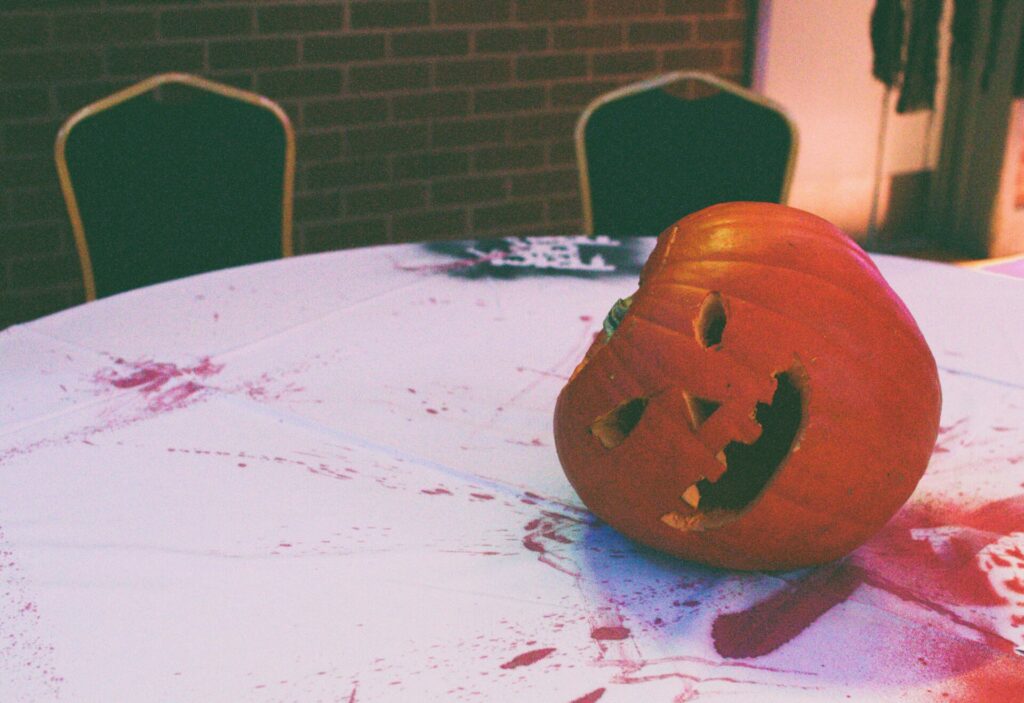 A carved pumpkin on a table. 
